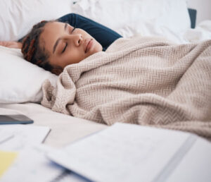 burnout sleeping and tired scholarship or university student in bed after study (1)